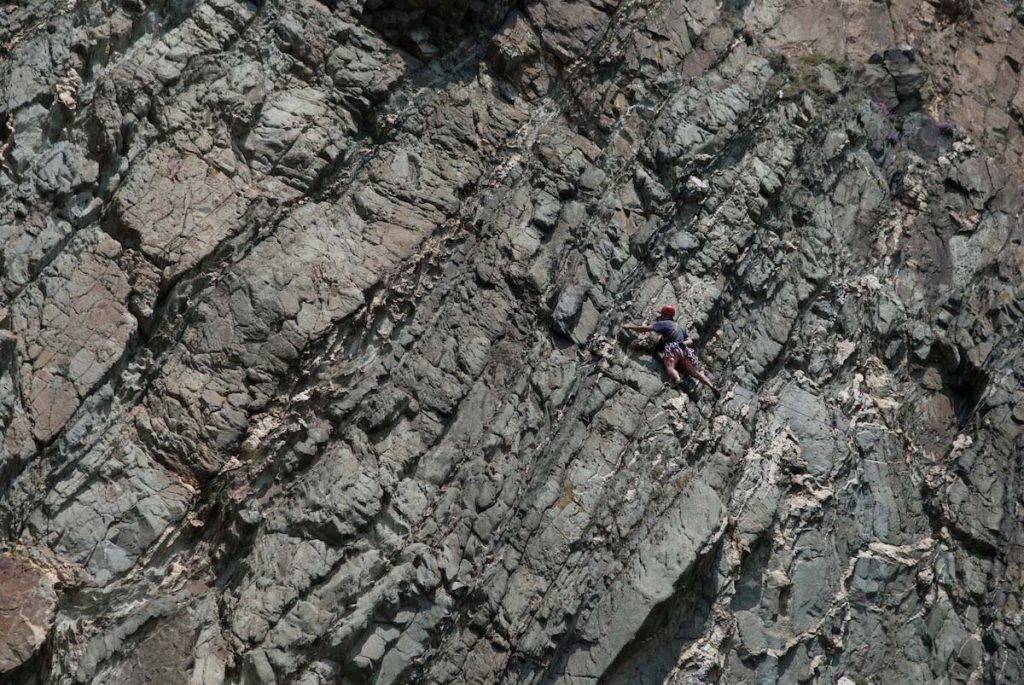 Creeping Leema, E2 5c, a classic girdle of the Yellow Wall Zawn. This route cross some amazing territory and most of the climbing is reasonable.