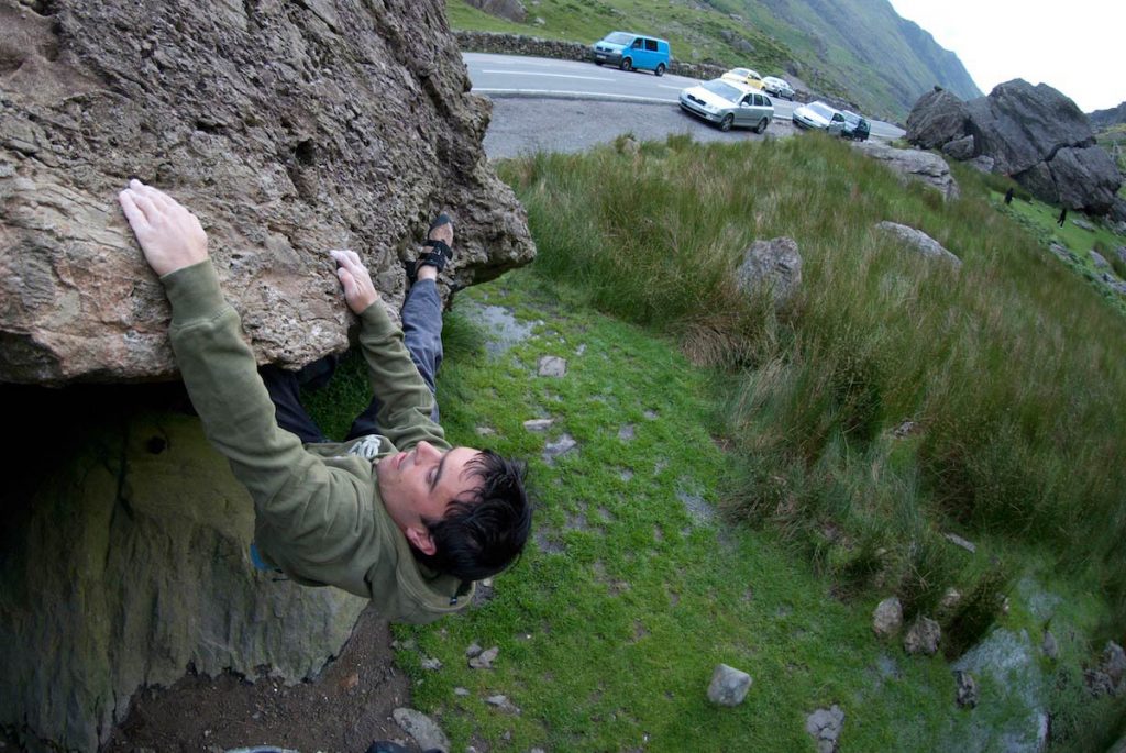Llion Morris on the Heel Hook Traverse a classic boulder problem on the Cromlech Boulders.