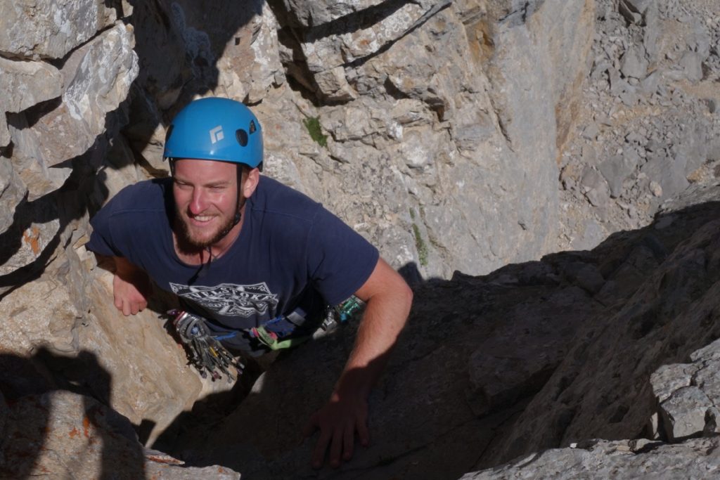 Josh Douglas climbing a Hard Severe limestone tower whilst being coach on his Trad Leading in the Picos Du Europa.
