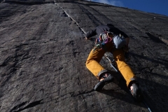 A climber starts up the classic E1, Seams the Same in the Dinorwic Slate Quarries.