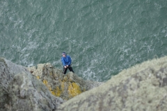 Alex Mason abseiling into Main Cliff to explore the possibilities of a new route.