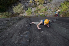 Hazel Robson with a determined look having made the crux step on Monsyter Kitten, E1 Dinorwic Slate.