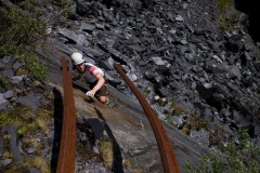 James Oswald reaching uop for the rails on the final move of Off the Beaten Track. E3 5c. Australia, Dinorwic Quarries.
