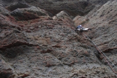 James McHaffie, onsighting the terrifying Gross Clinic, E6 6b. Yes in that choss is a 6b pull of a dubious edge!