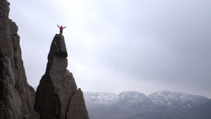 Snowdonia Mountain Guides owner on top of Napes Needle in the Lake District. The world's first real rock climb.