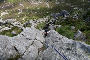 Guiding a client up Grooved Arete