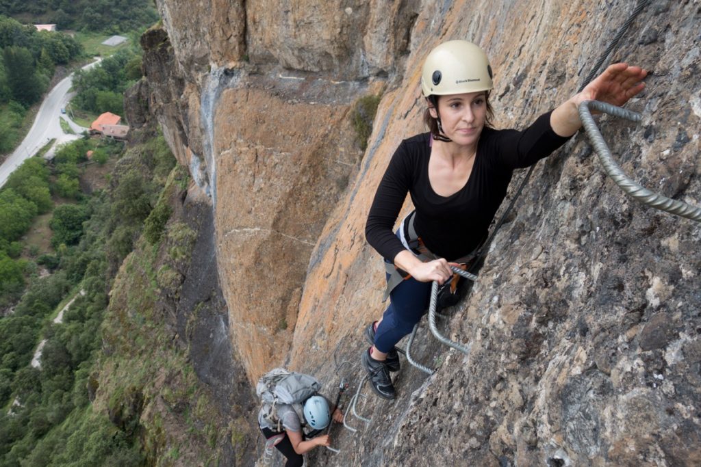 A climber enjoying her day off on one of the two great Via Ferrata in the Potes area of the Picos Du Europa.