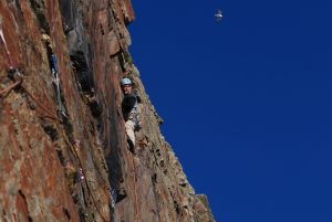 Mark Reeves stepping up into the fine groove of North West Passage a classic E1 on Castell Helen, South Stack, Gogarth