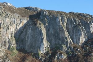 The Upper Tier of Gogarth, with the stand out crackline of The Strand, E2 clearly seen 'standing out' from the rest of the lichen covered rock on the left of the shot.