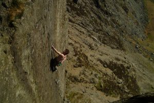 Ollie Cain looking in control as he nears the final crux wall of the power sapping Foil, E3, Dinas Cromlech.