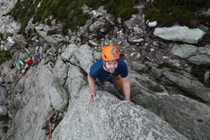 One of our clients enjoying the coaching on Pigeon Hole Crack at Holyhead Mountain