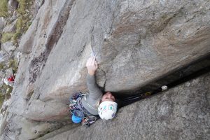Kate Carrother showing her american heritage by storming up another crack on our trad climbing tour of the UK. Here on Original Route on the Holly Tree Wall on Idwal Slabs.