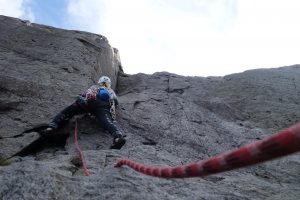 Tackling the hard start to Groove Above, a tricky severe on the continuation wall of Idwal Slabs