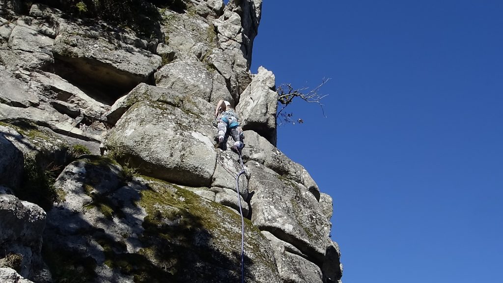 Emma leading up Needle Arete at the Dewerstone on a mini Trad tour.