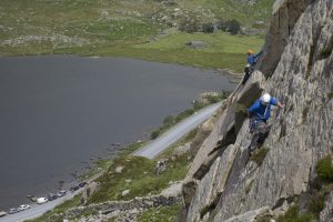 Climbers on the classic routes Rowan Route in the foreground and Super Direct in the background, on Milestone Buttress, Ogwen Valley.