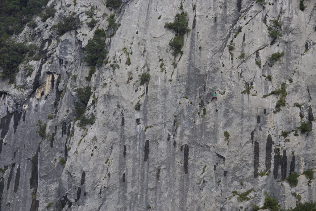 A climber in action on one of the long 6c on La Piramide, Ramales.